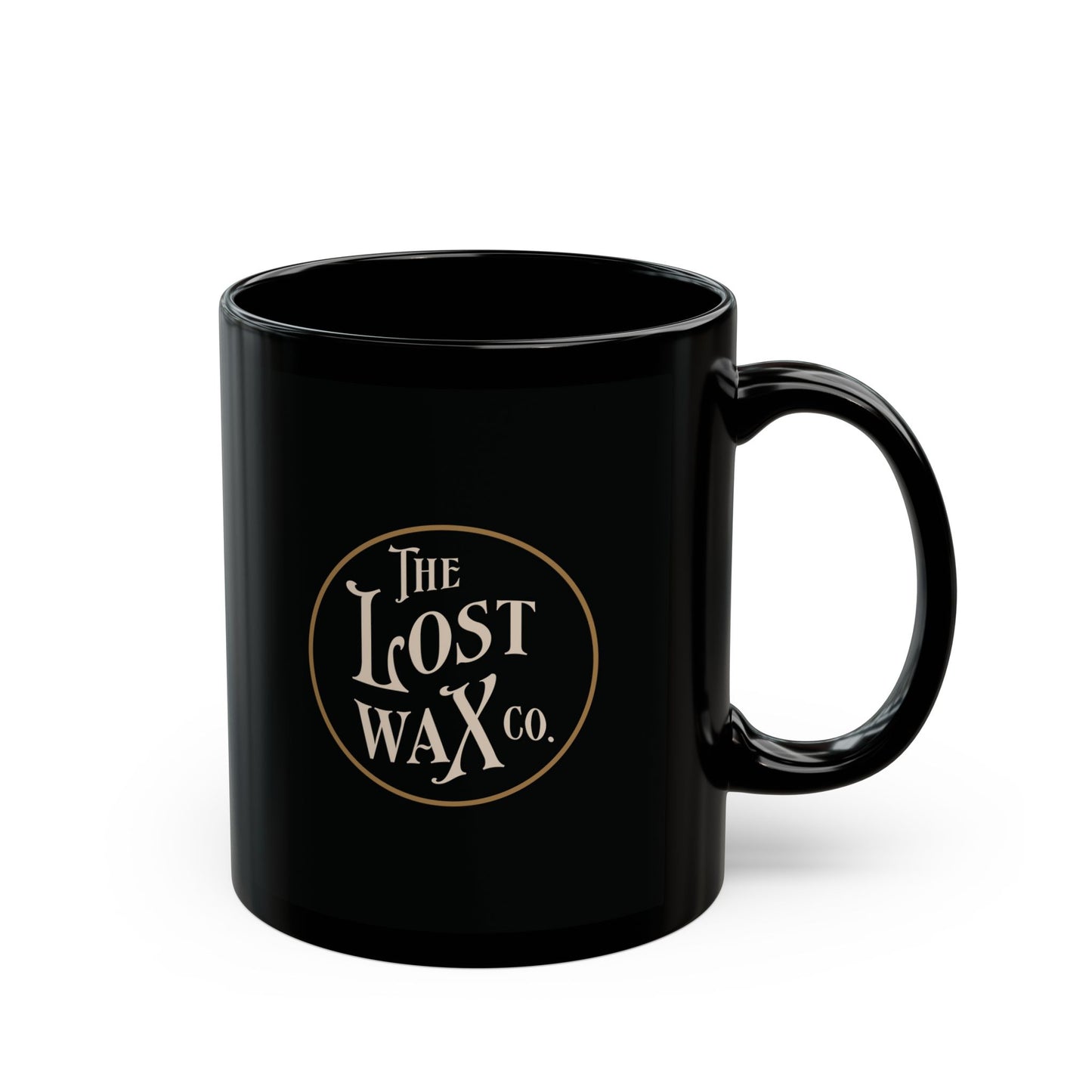 Black mug with 'The Lost Wax Co.' logo on a white background