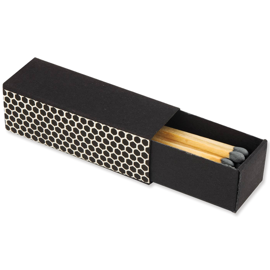 Black matchbox with honeycomb pattern and matches inside on a white background