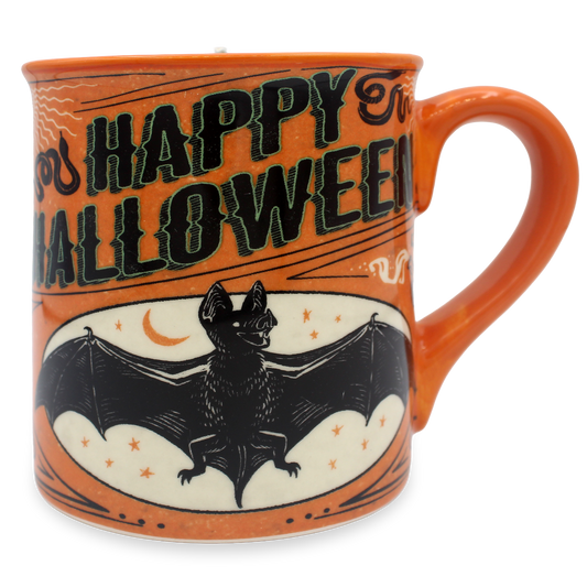 An orange ceramic mug with a Halloween design, featuring the text 'HAPPY HALLOWEEN' in black with a green outline, a black bat illustration, and a cream-colored oval background with stars and a crescent moon.