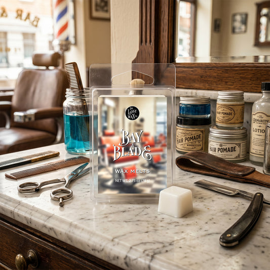 Bay Blade wax melts packaging on a marble counter with grooming tools and products.