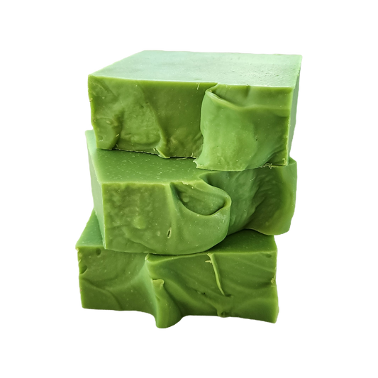 3 bars of handmade green soap stacked on top of each other.