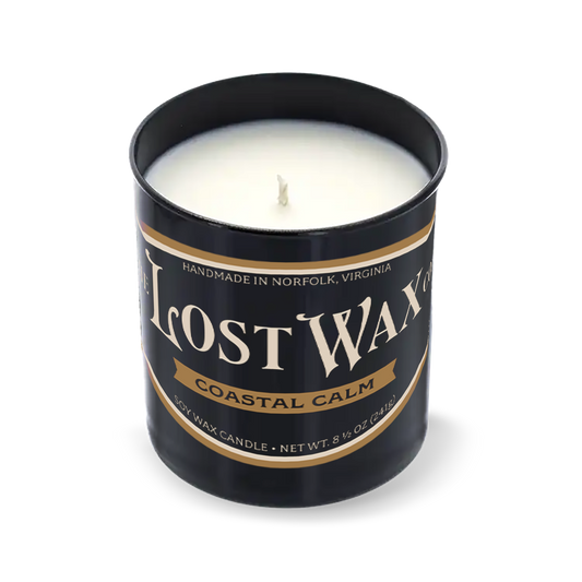 Coastal Calm scented candle in a black container with 'The Lost Wax Company' branding on a white background