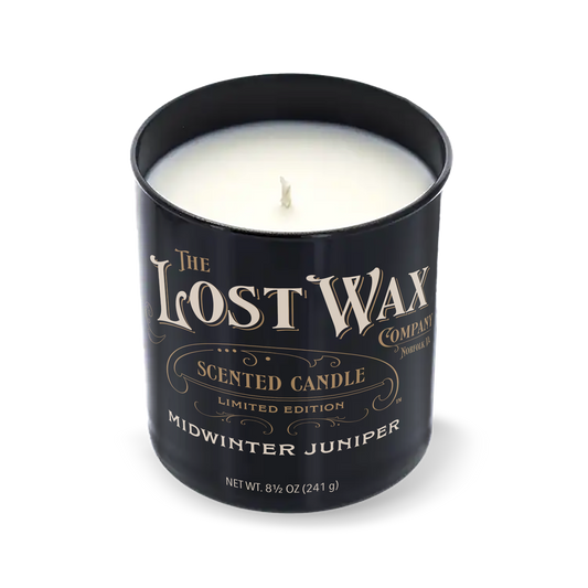 Midwinter Juniper Candle in a black container with 'The Lost Wax Company' branding on a white background