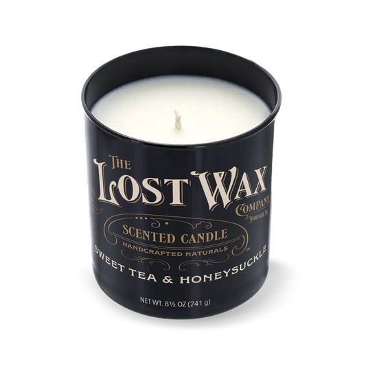 Sweet Tea & Honeysuckle scented candle in a black container with 'The Lost Wax Company' branding on a white background