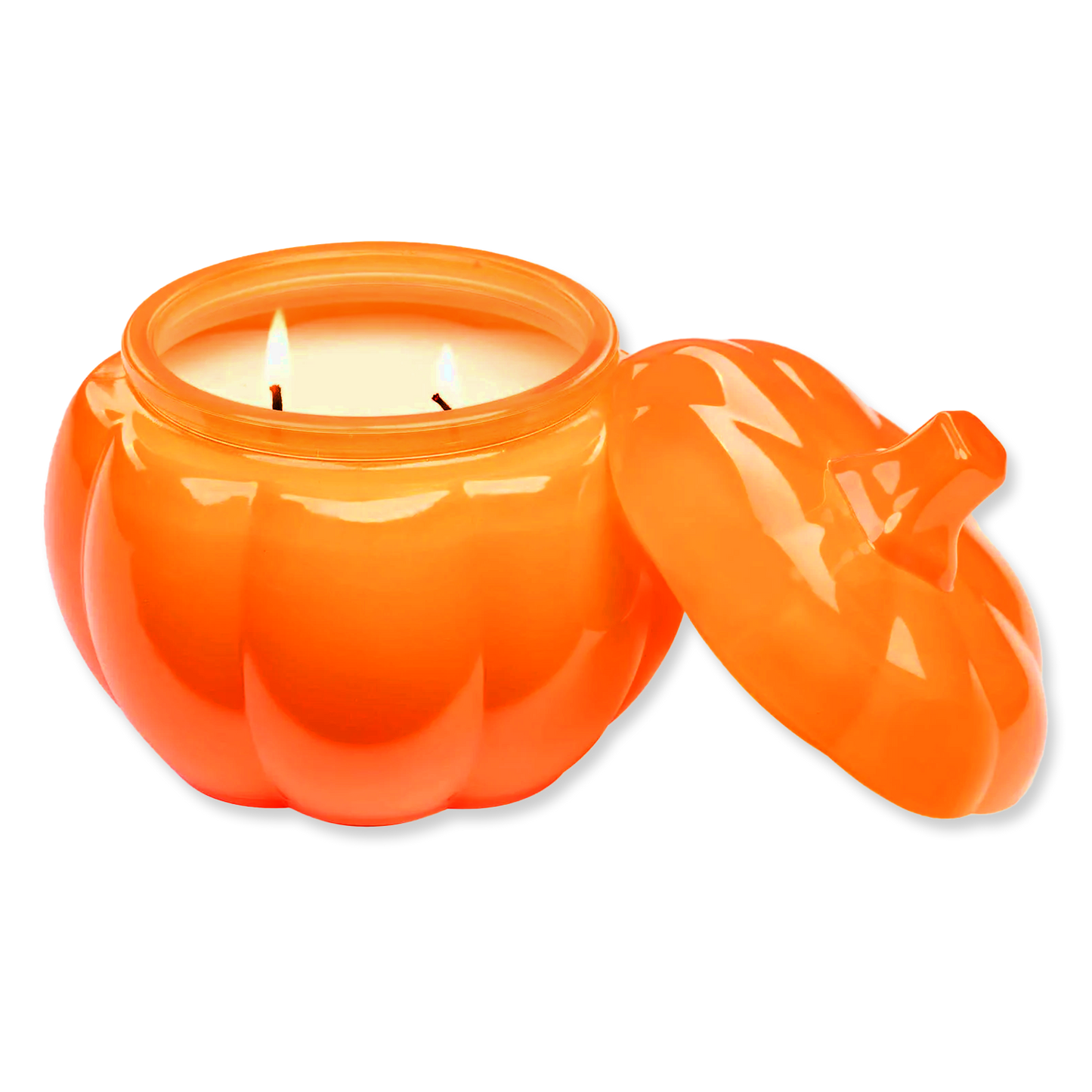 Orange pumpkin-shaped candle with a lit wick on a white background