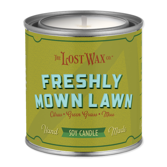 Candle canister labeled 'Freshly Mown Lawn' by Frost Wax on a white background
