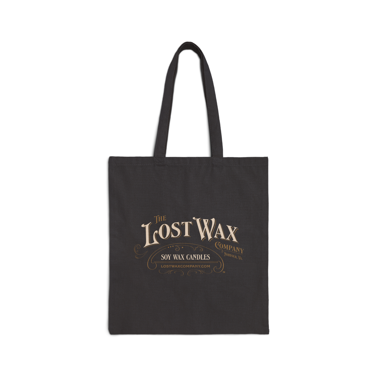 Black tote bag with 'The Lost Wax Company' logo on a white background