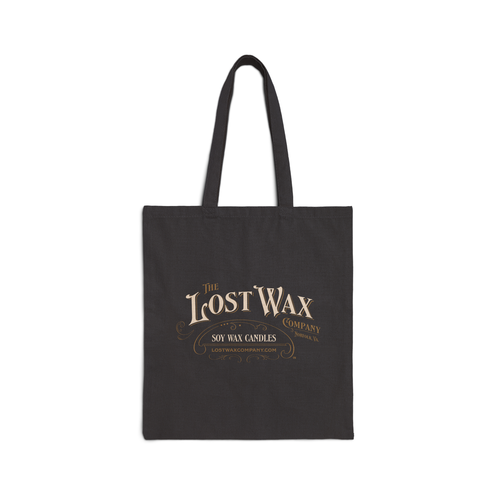 Black tote bag with 'The Lost Wax Company' logo on a white background