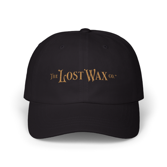 Black cap with 'The Lost Wax Co.' logo on a white background