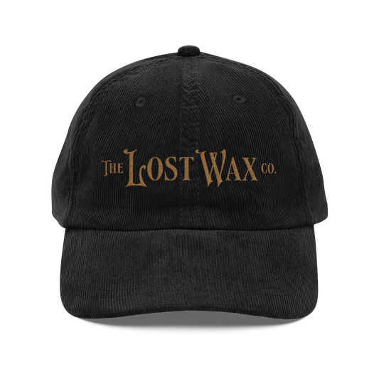 Black cap with 'The Lost Wax Co.' logo on a white background