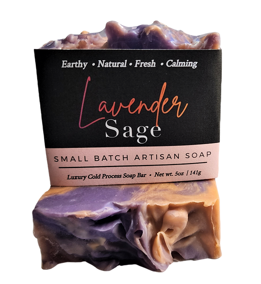 Lavender Sage small batch artisan soap bar with a black paper label, shown on a white background. The soap has a marbled purple and warm tan coloration.