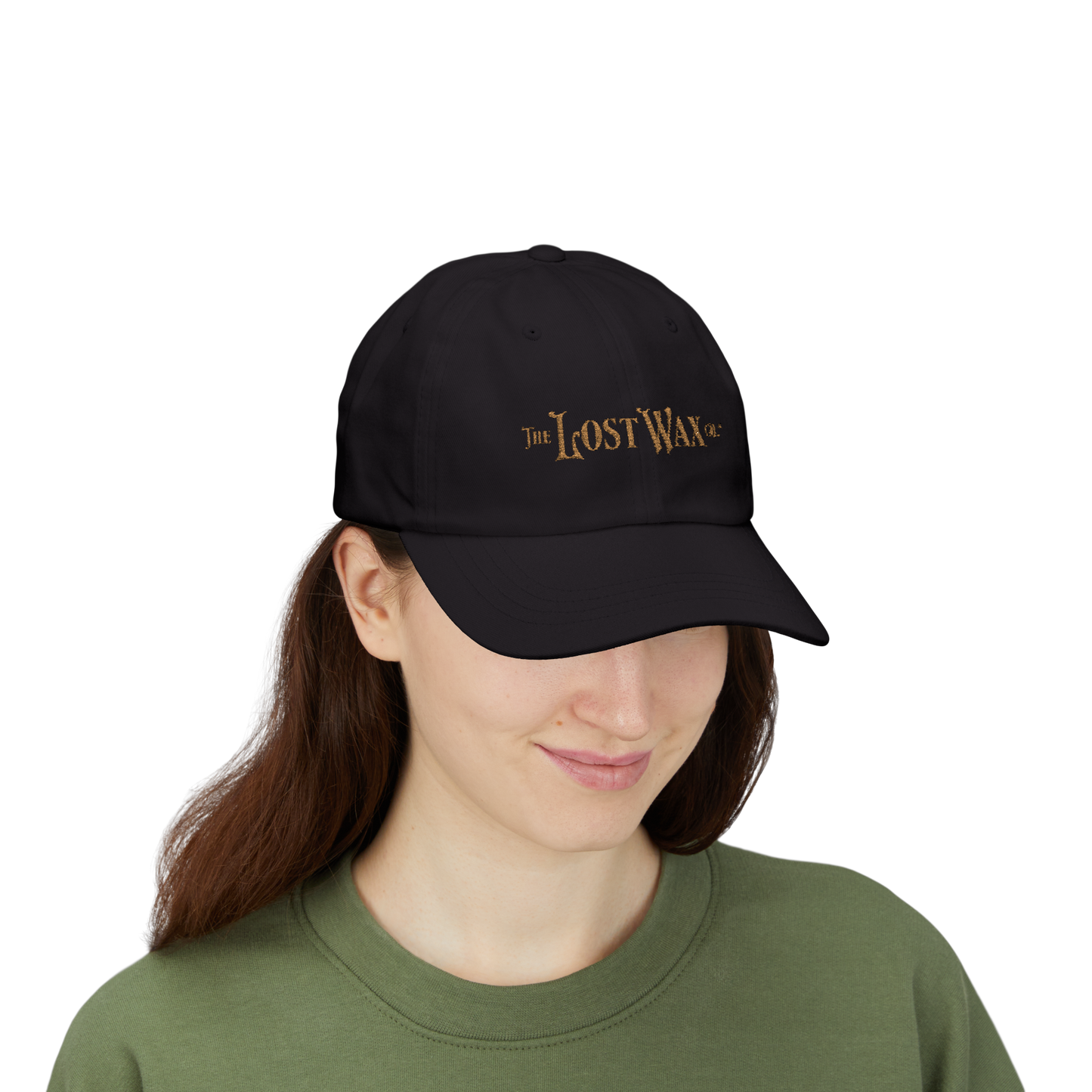 Person wearing a black cap with 'The Lost Wax' logo on a white background