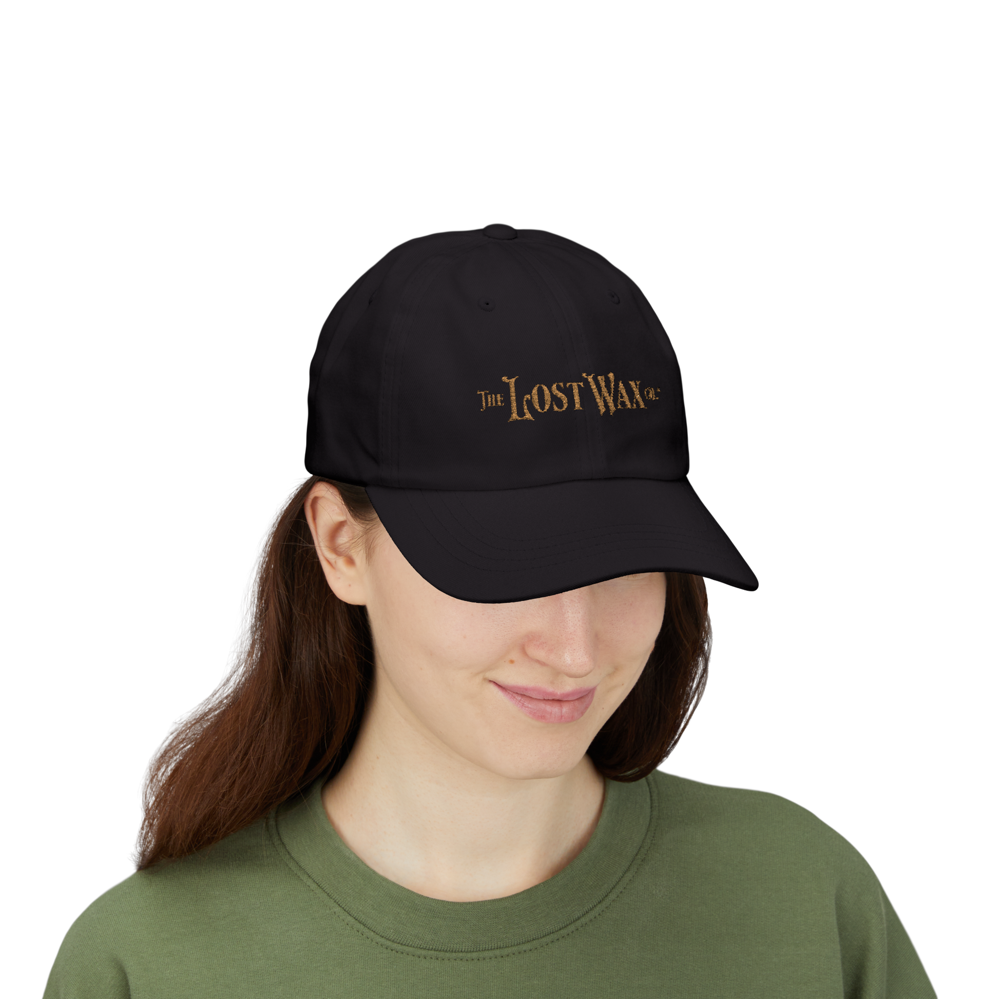 Person wearing a black cap with 'The Lost Wax' logo on a white background