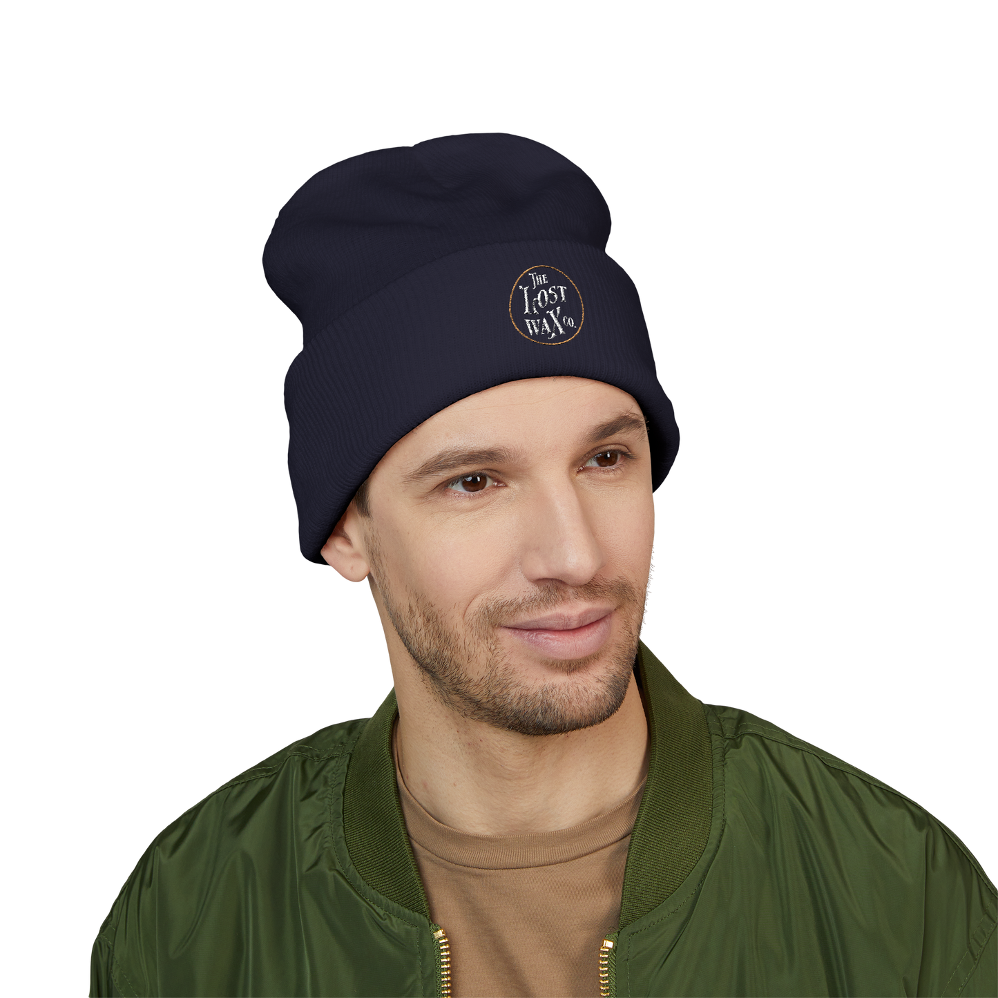 Man wearing a navy beanie with a logo on a white background