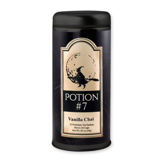 A black cylindrical tin of Potion #7 Vanilla Chai tea sachets, featuring a gold and black label with a witch riding a broomstick against a full moon graphic.