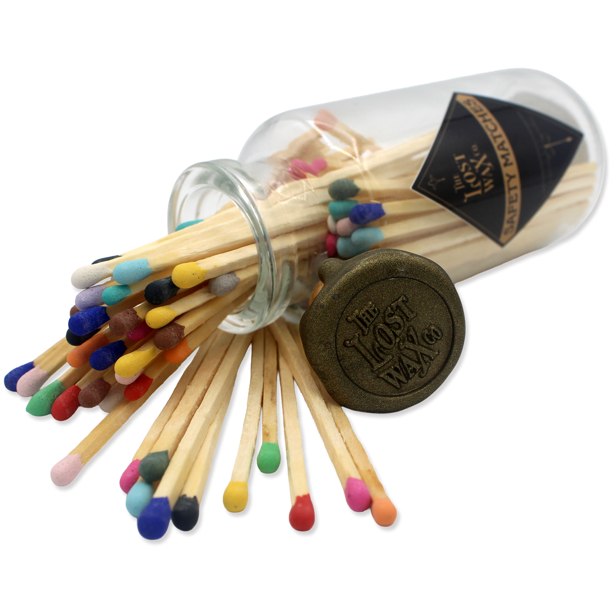 Glass jar with cork lid containing colorful safety matches from The Lost Wax Co.