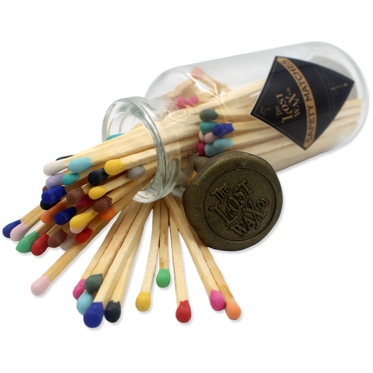 Glass jar with cork lid containing colorful safety matches from The Lost Wax Co.