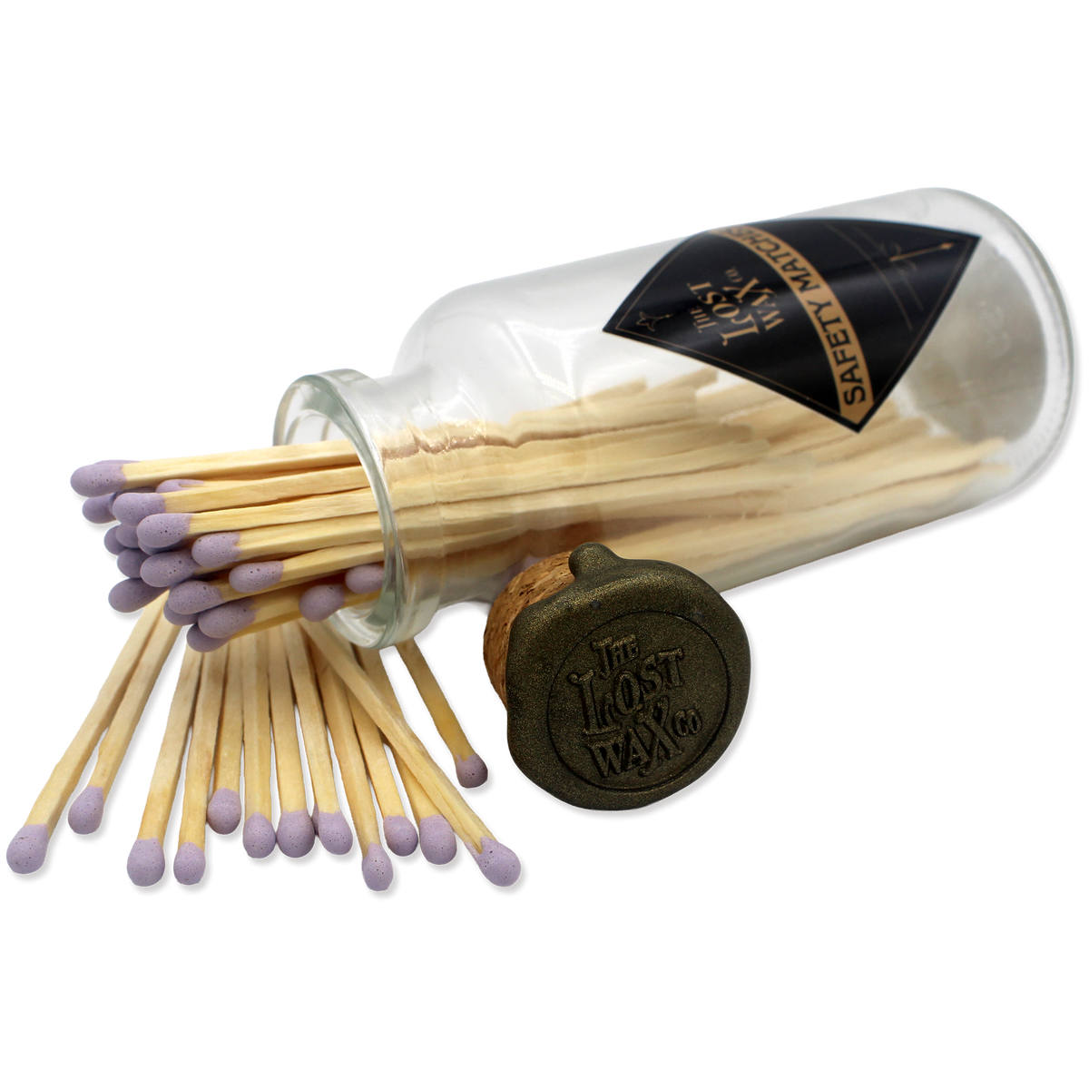 Glass jar with cork lid containing lavender-tipped safety matches branded 'The Lost Wax Co'.