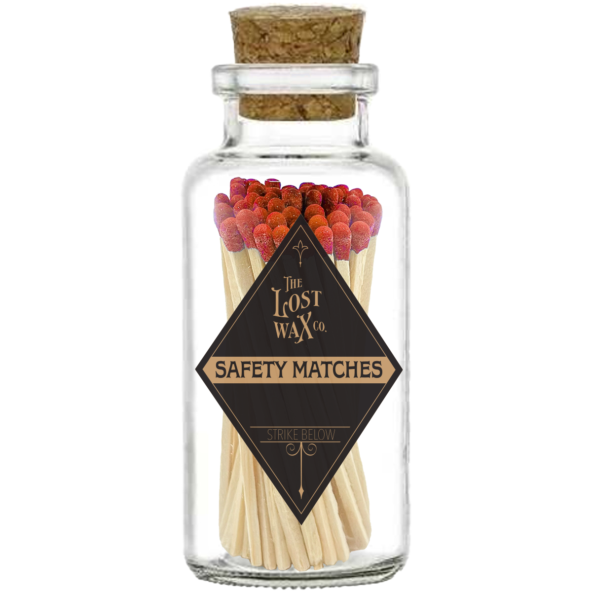Glass jar with cork lid containing red safety matches branded 'The Lost Wax Co'.