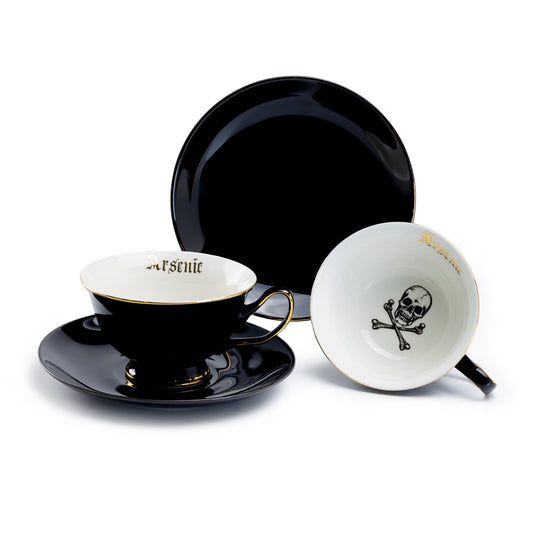 Black and white teacup set with skull design on a white background