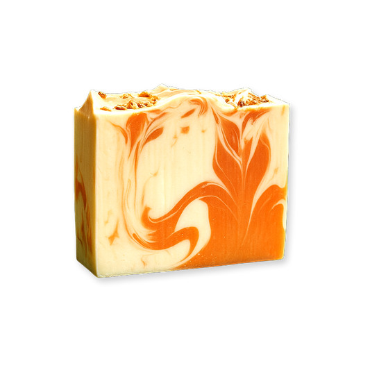 Single bar of handmade soap with swirls of orange and cream colors.