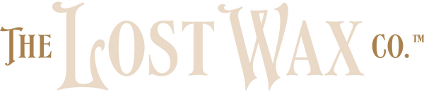 Logo of The Lost Wax Co. in beige text on a white background