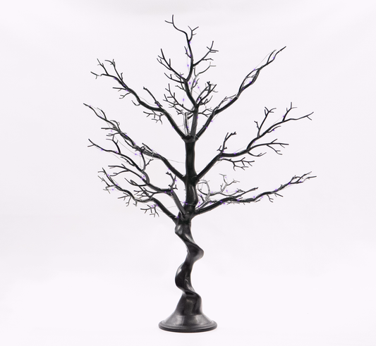 Black artificial tree with twisted trunk on a white background