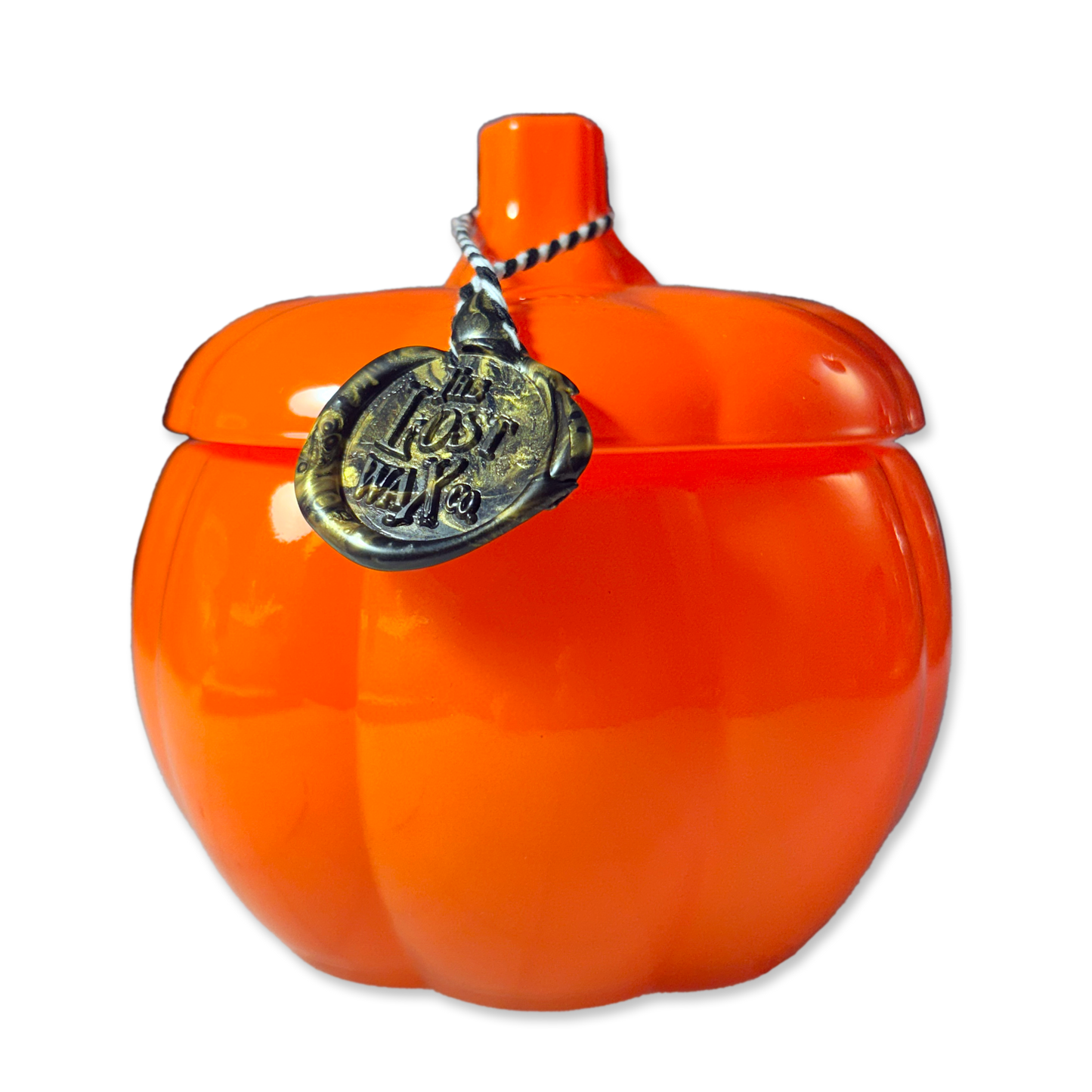 Orange pumpkin-shaped container on a white background