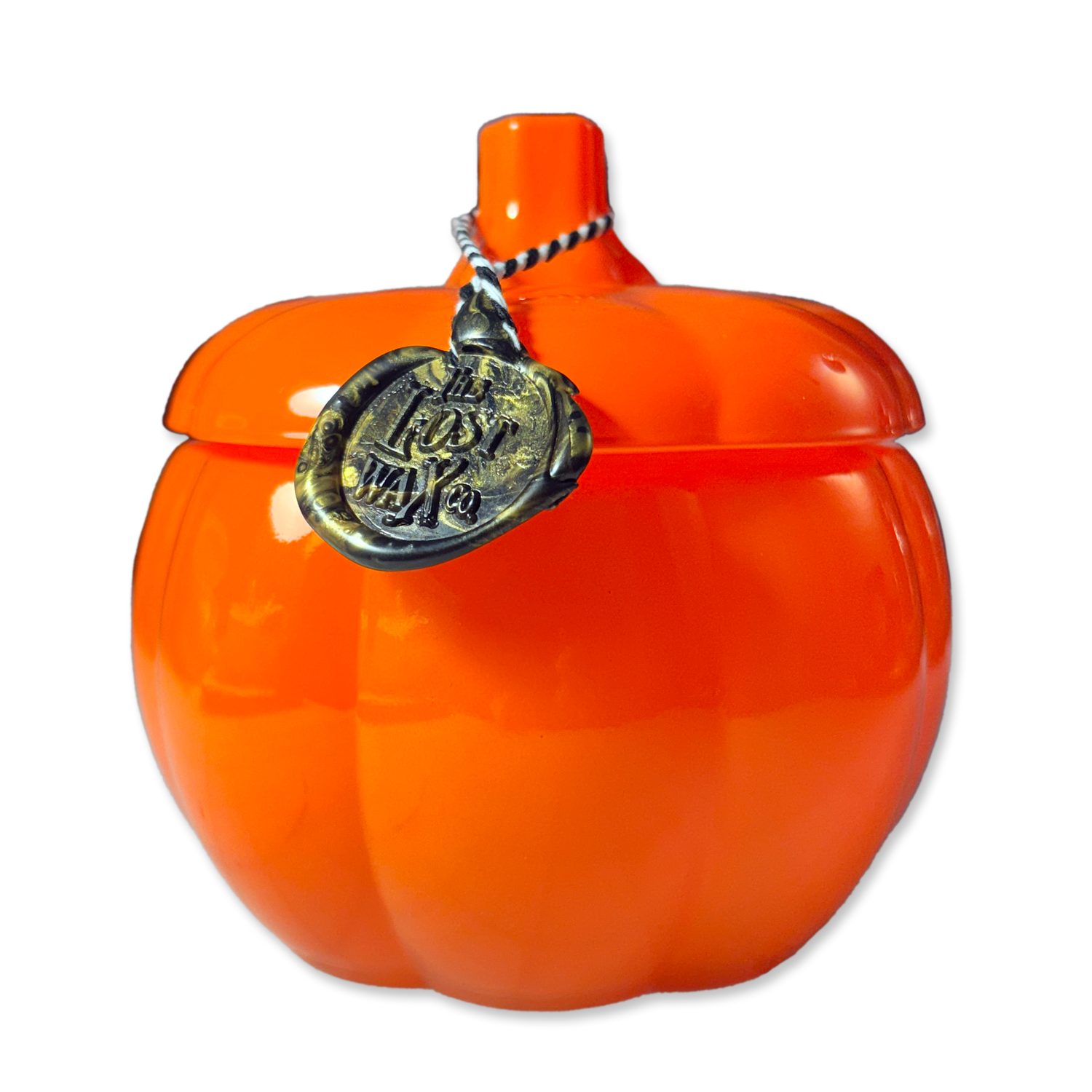 Orange pumpkin-shaped container on a white background