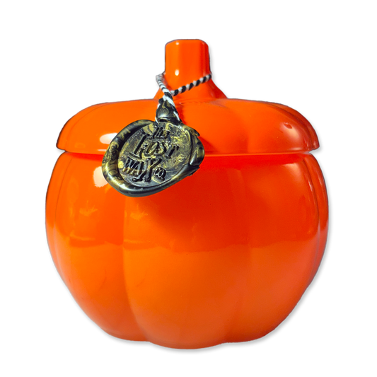 Orange pumpkin-shaped container on a white background