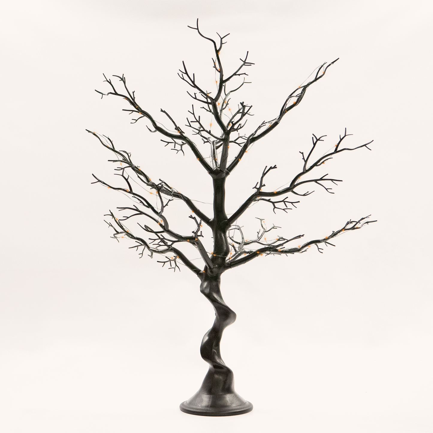 Decorative black tree with bare branches on a white background