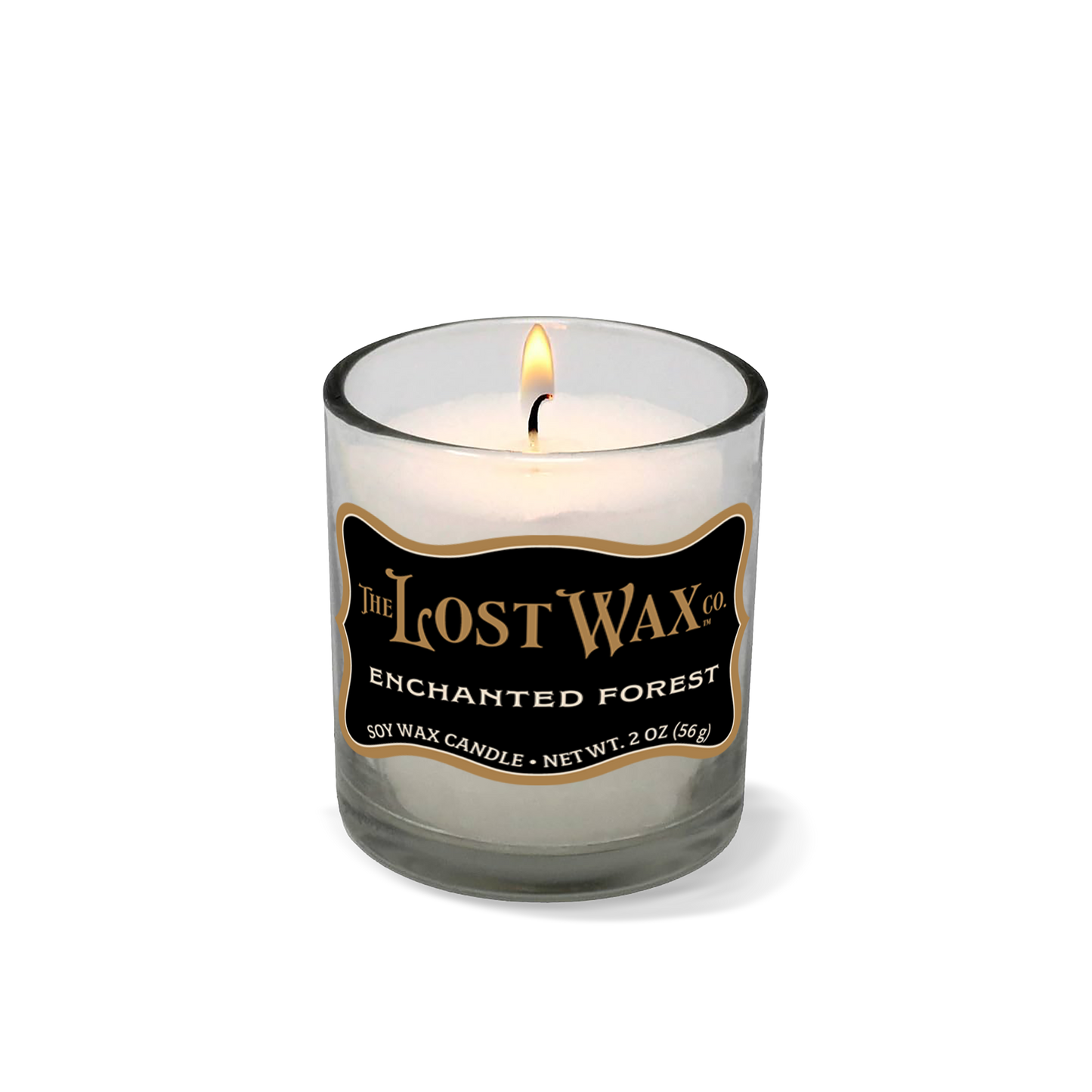 Candle in a glass container with 'The Lost Wax Company' branding on a white background
