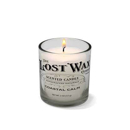 Coastal Calm scented candle in a glass container with 'The Lost Wax Company' branding on a white background