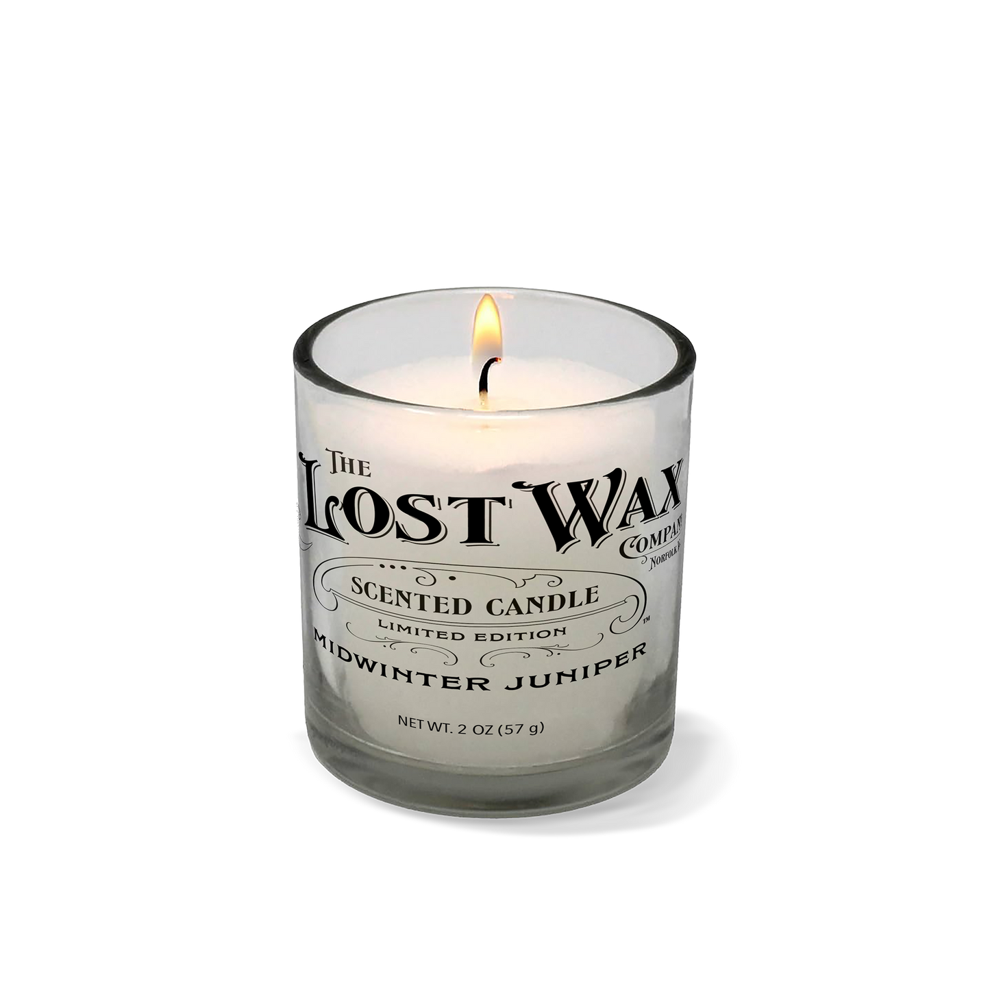Midwinter Juniper Candle in a glass container with 'The Lost Wax Company' branding on a white background