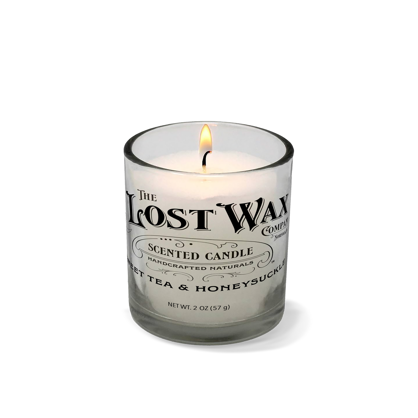 Sweet Tea & Honeysuckle scented candle in a glass container with 'The Lost Wax Company' branding on a white background.
