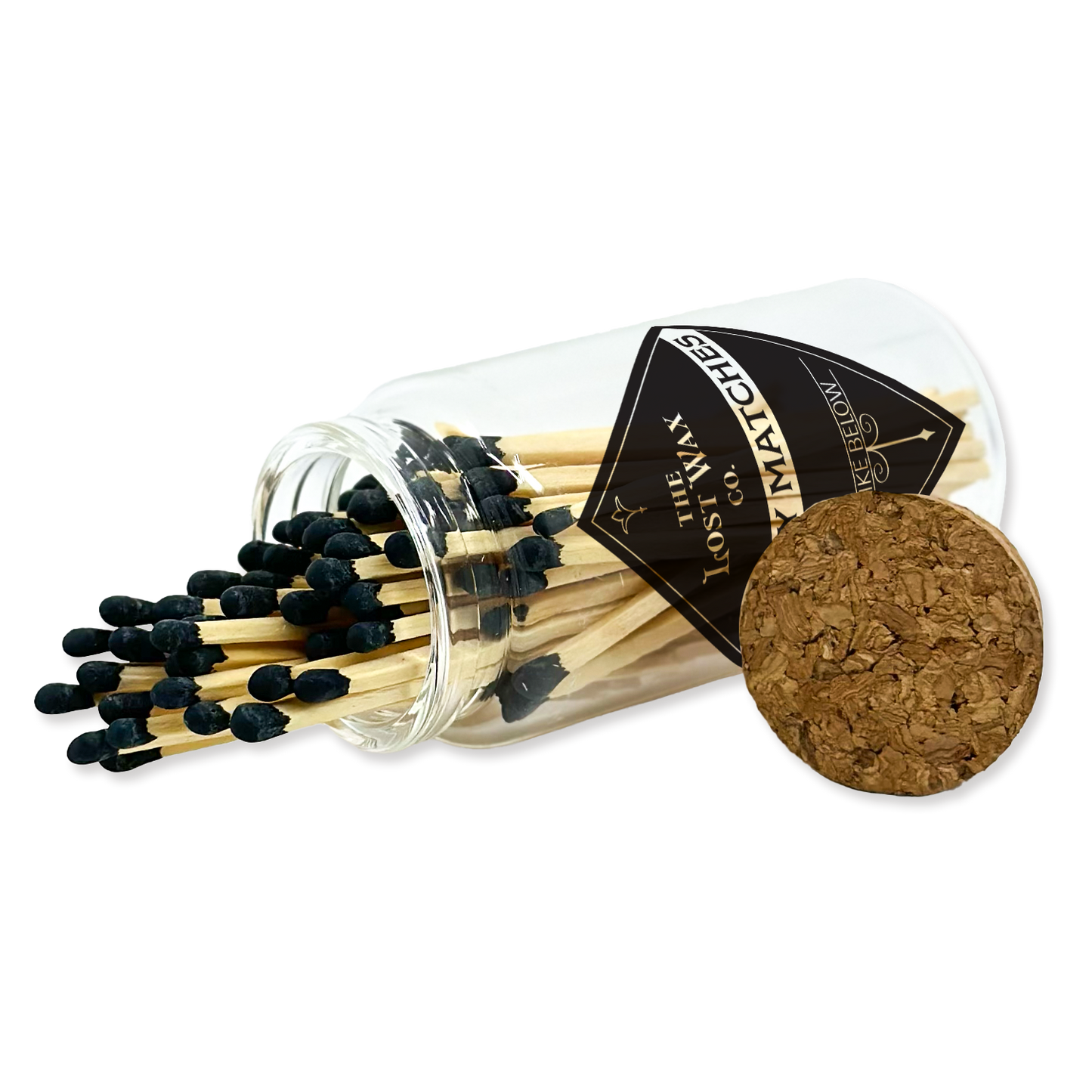 Matches with a clear glass container and cork lid on a white background