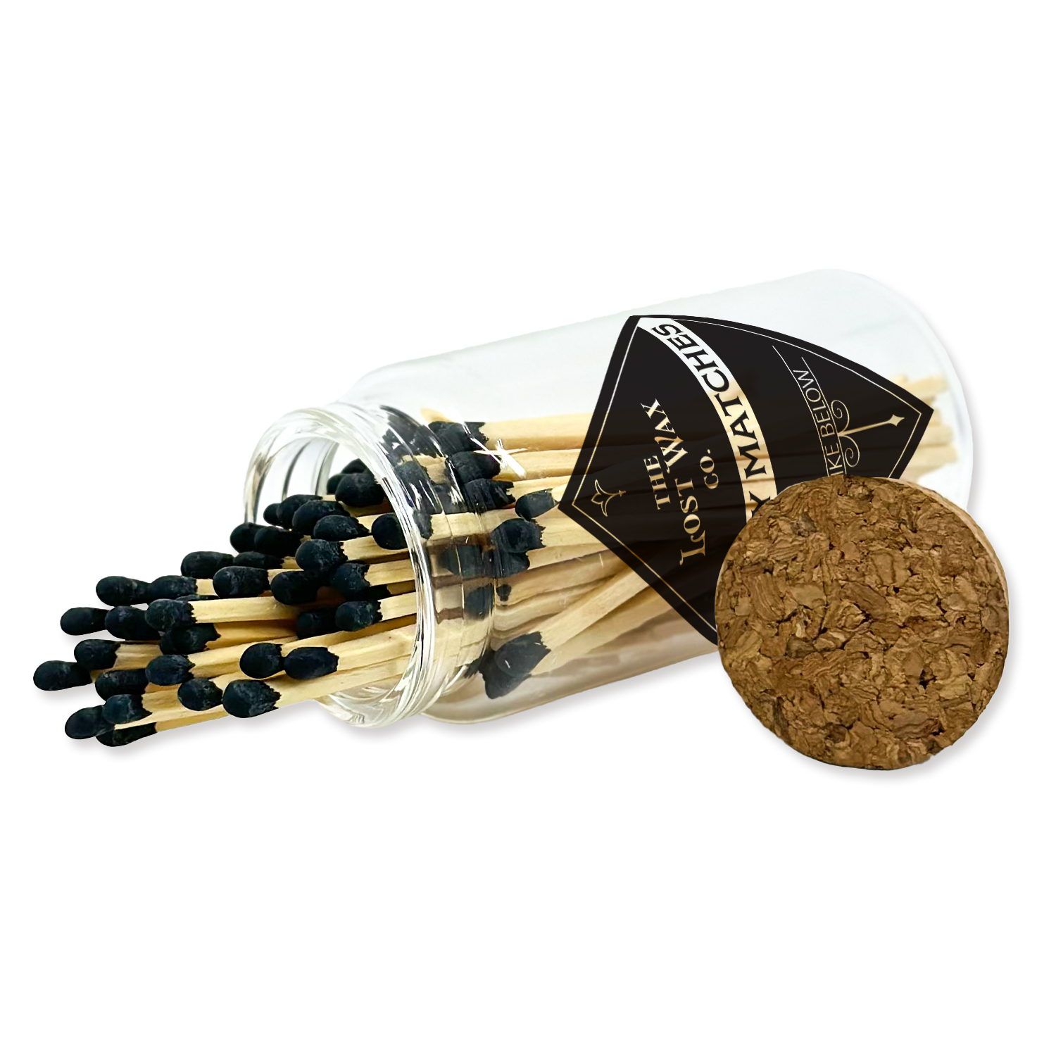 Matches with a clear glass container and cork lid on a white background