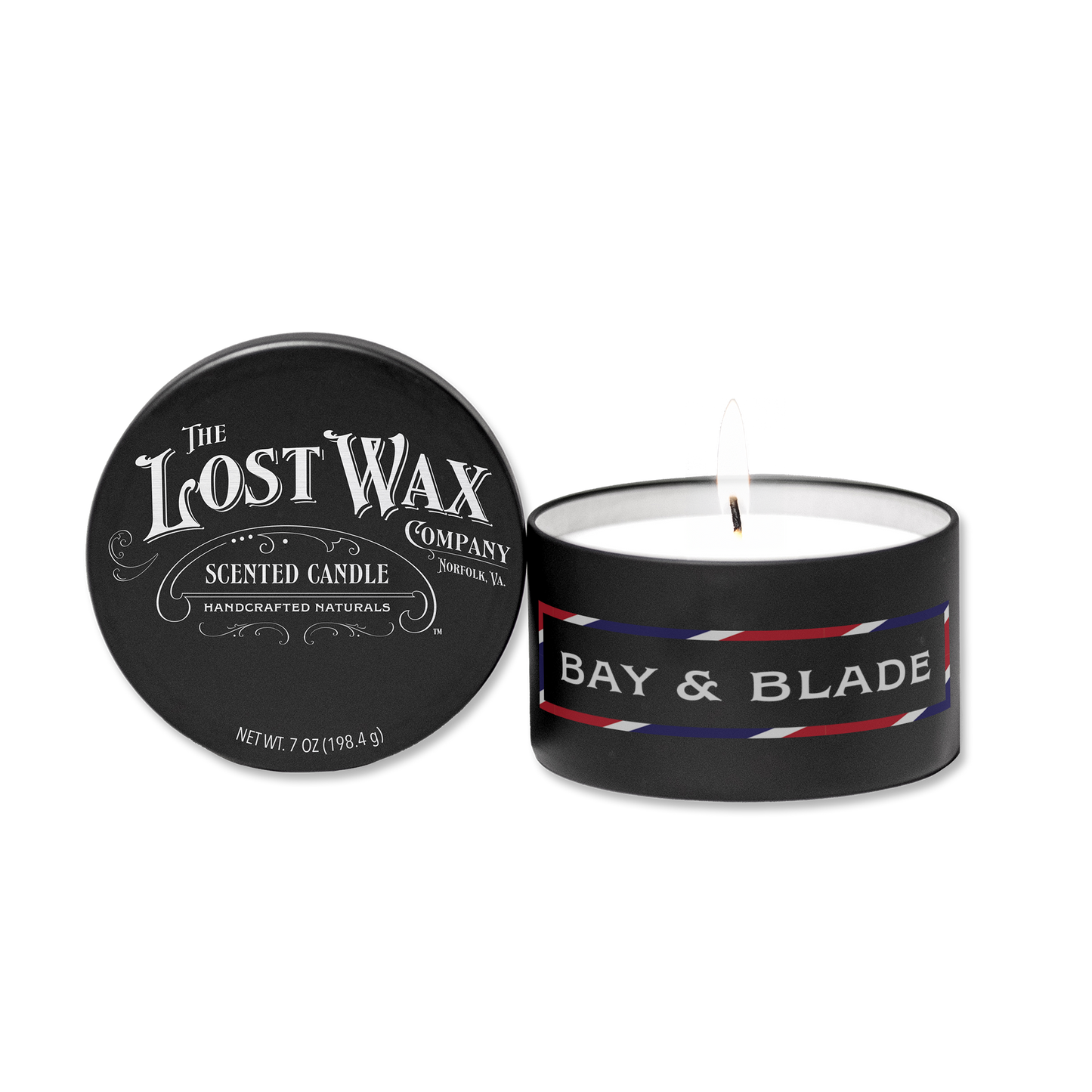 Scented candle with 'Bay & Blade' label and lid from 'The Lost Wax Company' on a white background