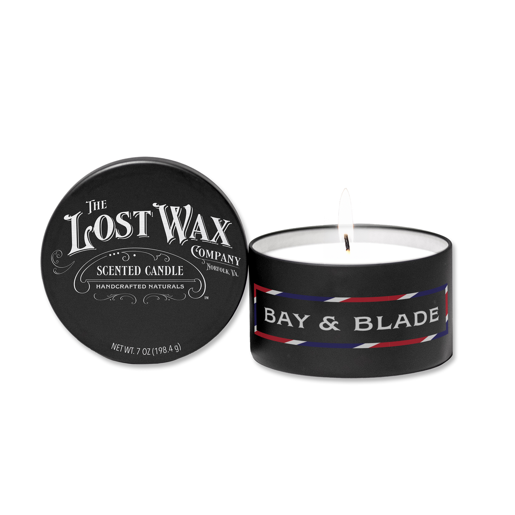 Scented candle with 'Bay & Blade' label and lid from 'The Lost Wax Company' on a white background