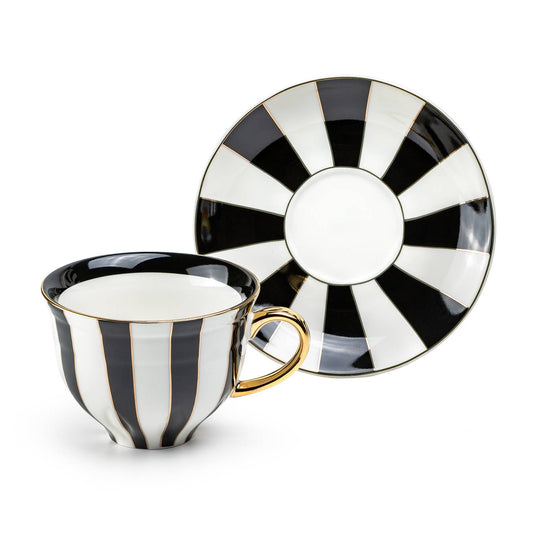 Black and white striped teacup and saucer on a white background