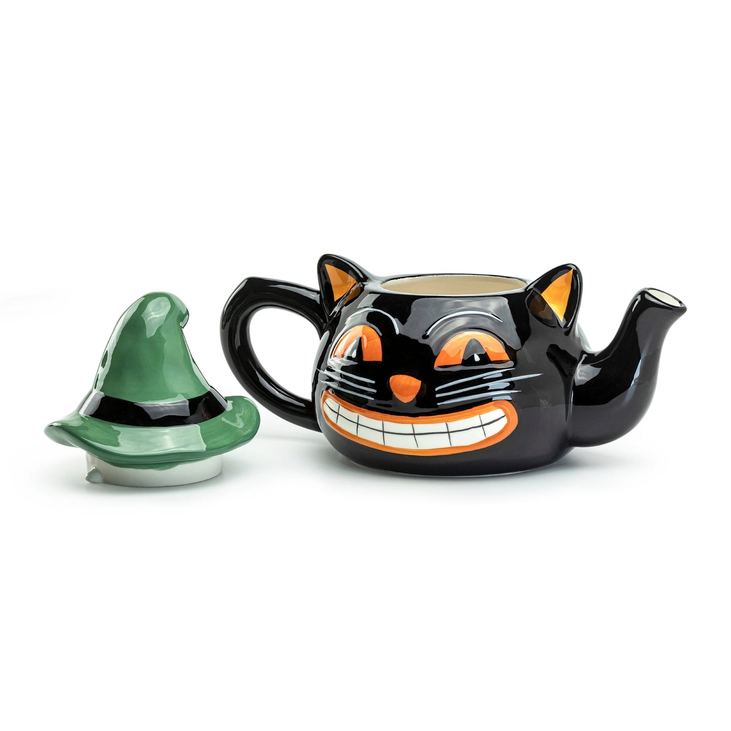 Black cat-shaped teapot with a green witch hat on a white background