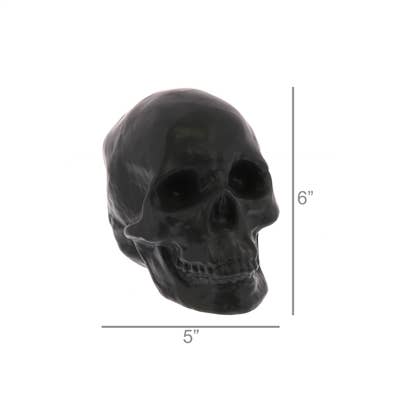 A glossy black skull-shaped decorative object shown on a white background with dimension lines indicating 5 inches wide and 6 inches tall.