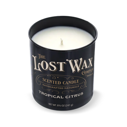 Tropical Citrus Scented candle in a black container with 'The Lost Wax Company' branding on a white background