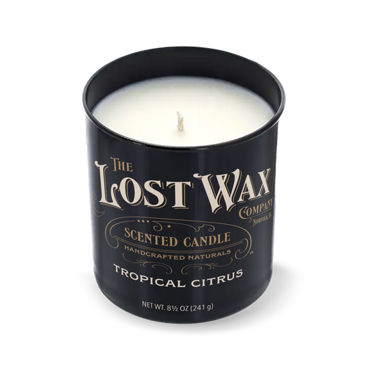 Tropical Citrus Scented candle in a black container with 'The Lost Wax Company' branding on a white background