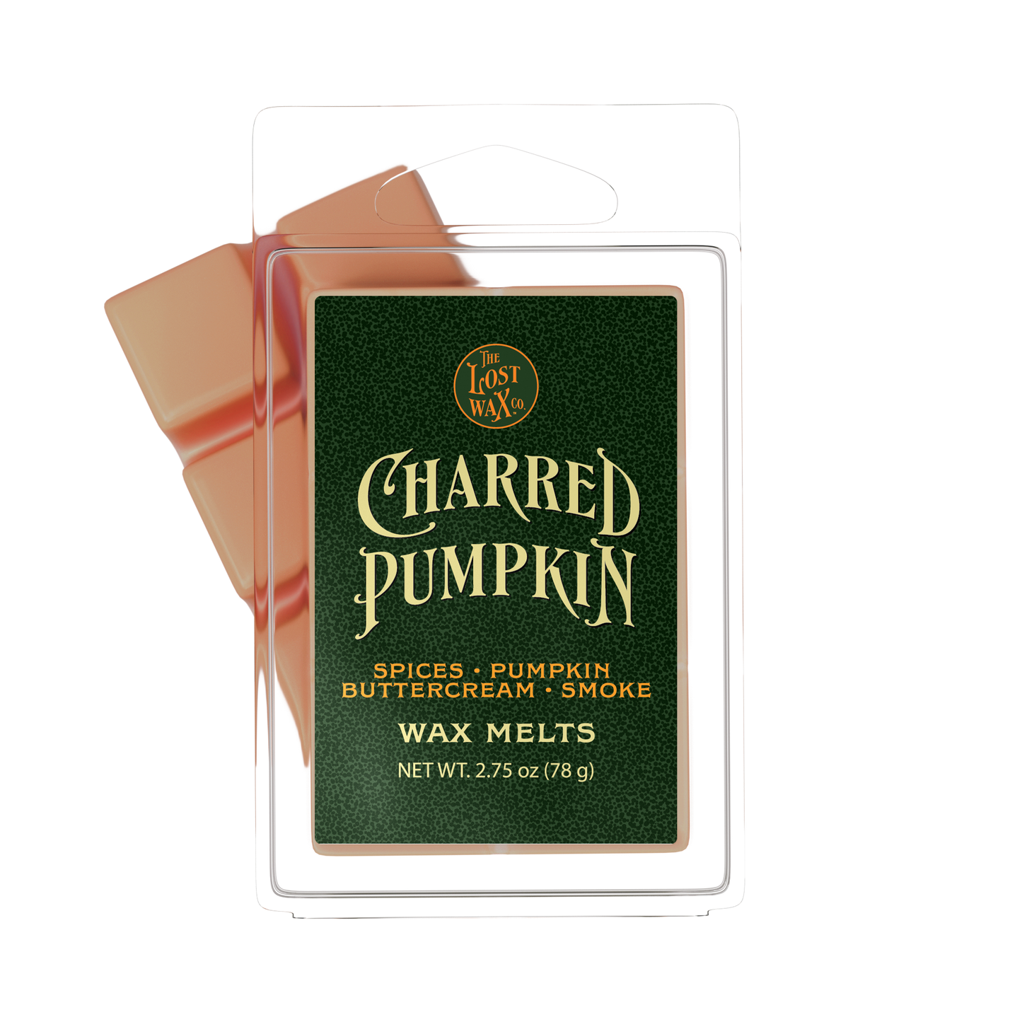 Lost Wax Co. Charred Pumpkin scent wax melts in a clear plastic clamshell package with a dark green label and orange-colored wax visible behind it on a white background.