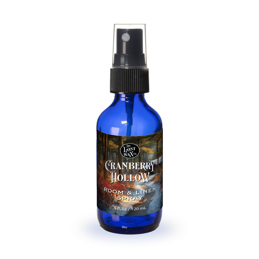 Blue spray bottle labeled 'Cranberry Hollow' on a white background