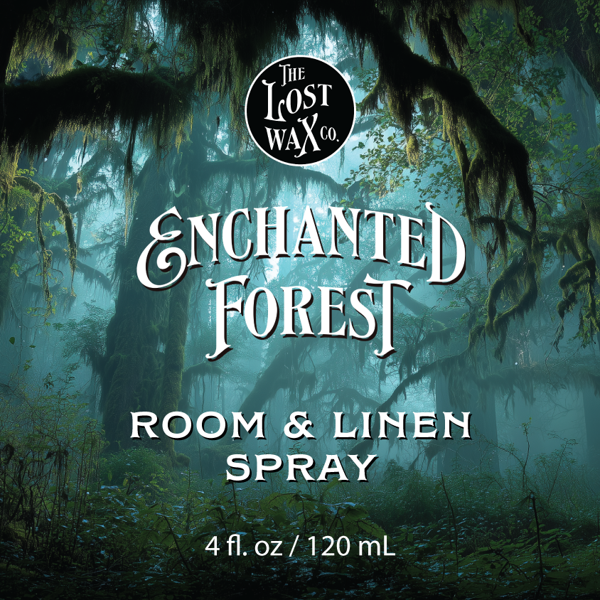 Label for 'Enchanted Forest Room & Linen Spray' by The Lost Wax Co. with an overgrown forest background.