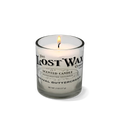 Candle in a clear glass holder on a white background
