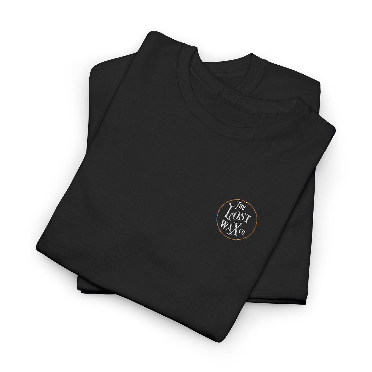 Folded black shirt with 'The Lost Wax Co' logo on a white background