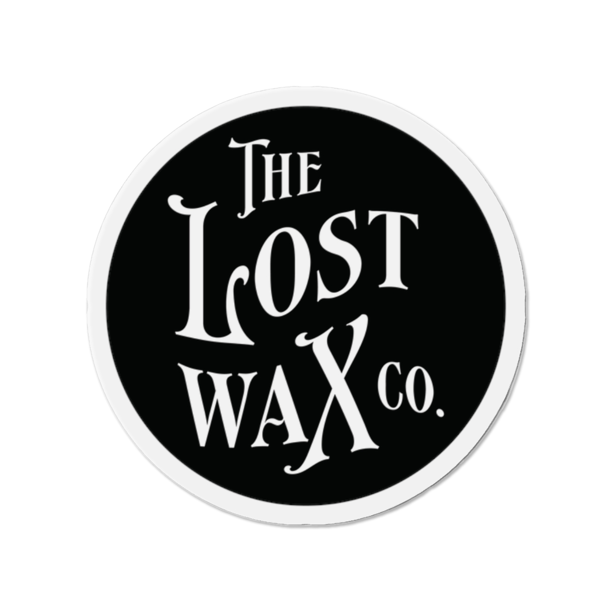 Round magnet with 'The Lost Wax Co.' text on a black background